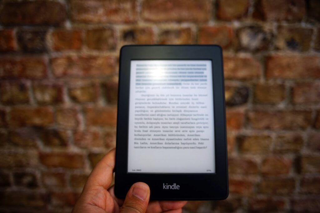 An eBook reader being held. 