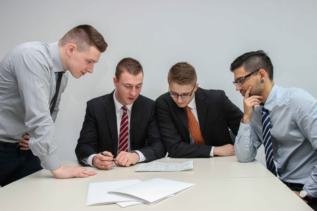 A group of professionals discussing different business structure options. 