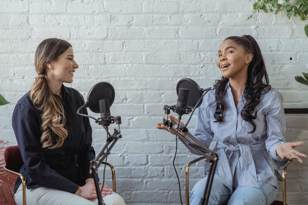 Two young women in a podcast studio.