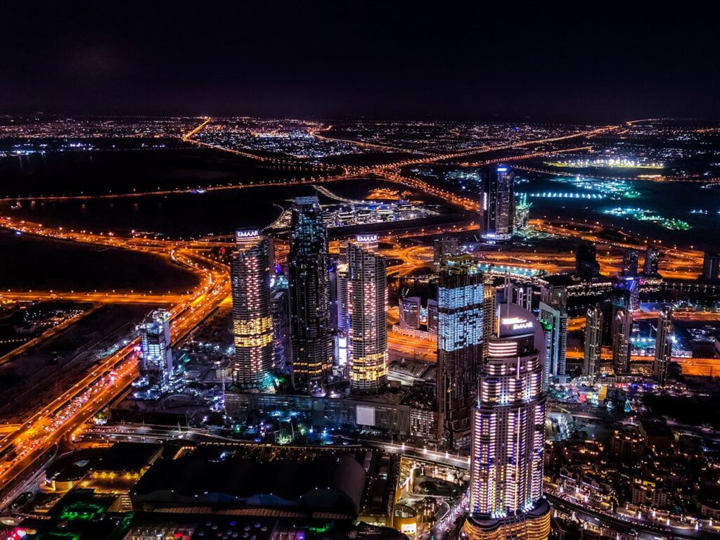 An aerial view of a night city skyline. 