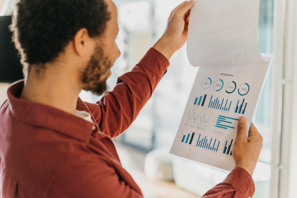 A marketing professional examining a collection of data visualisations.